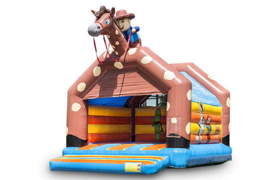 Große aufblasbare hüpfburg mit dach im cowboy-design zum kaufen für kinder. Erhältlich bei JB-Hüpfburgen Deutschland online